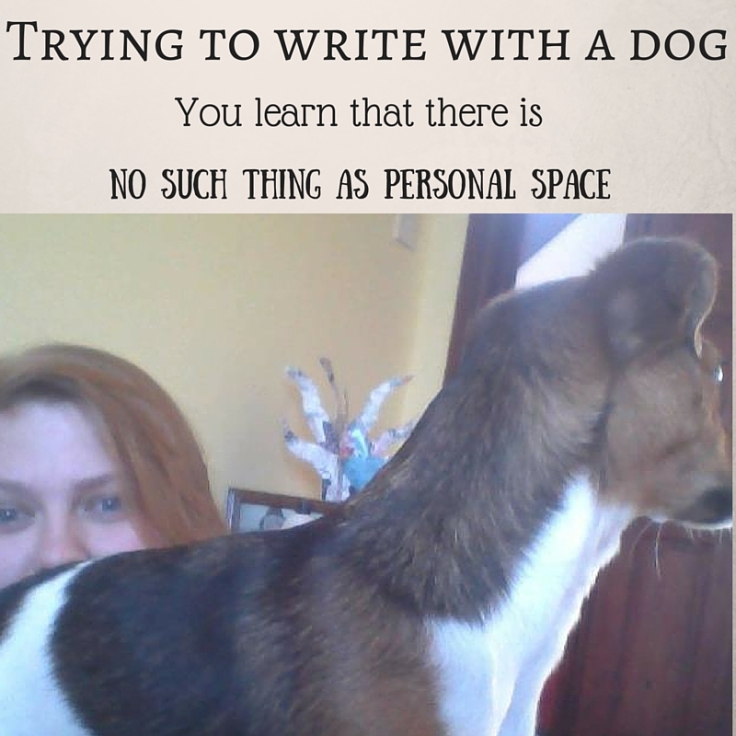 Trying to write with a dog.jpg